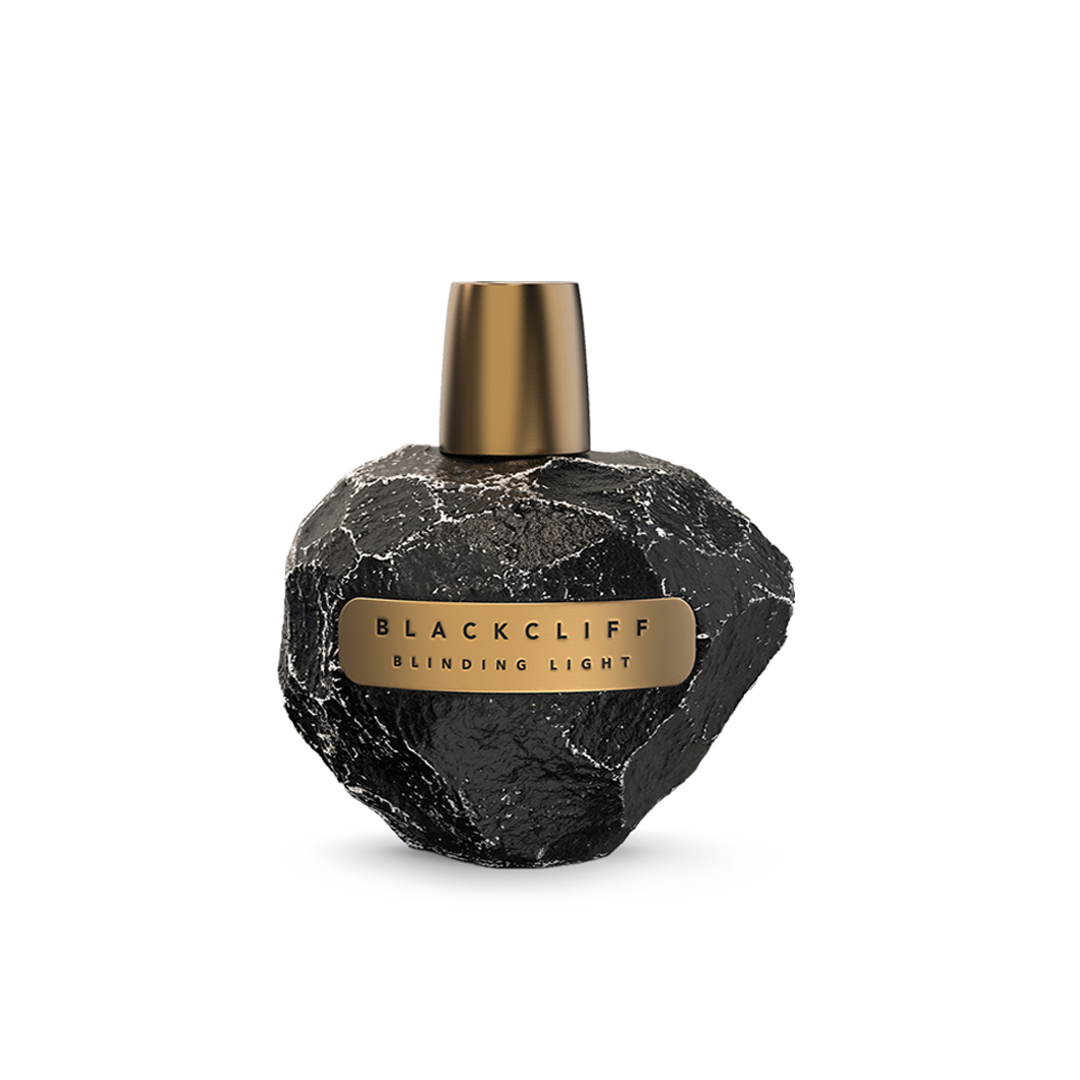 Perfume bottle: black stone-textured glass with gold cap and label