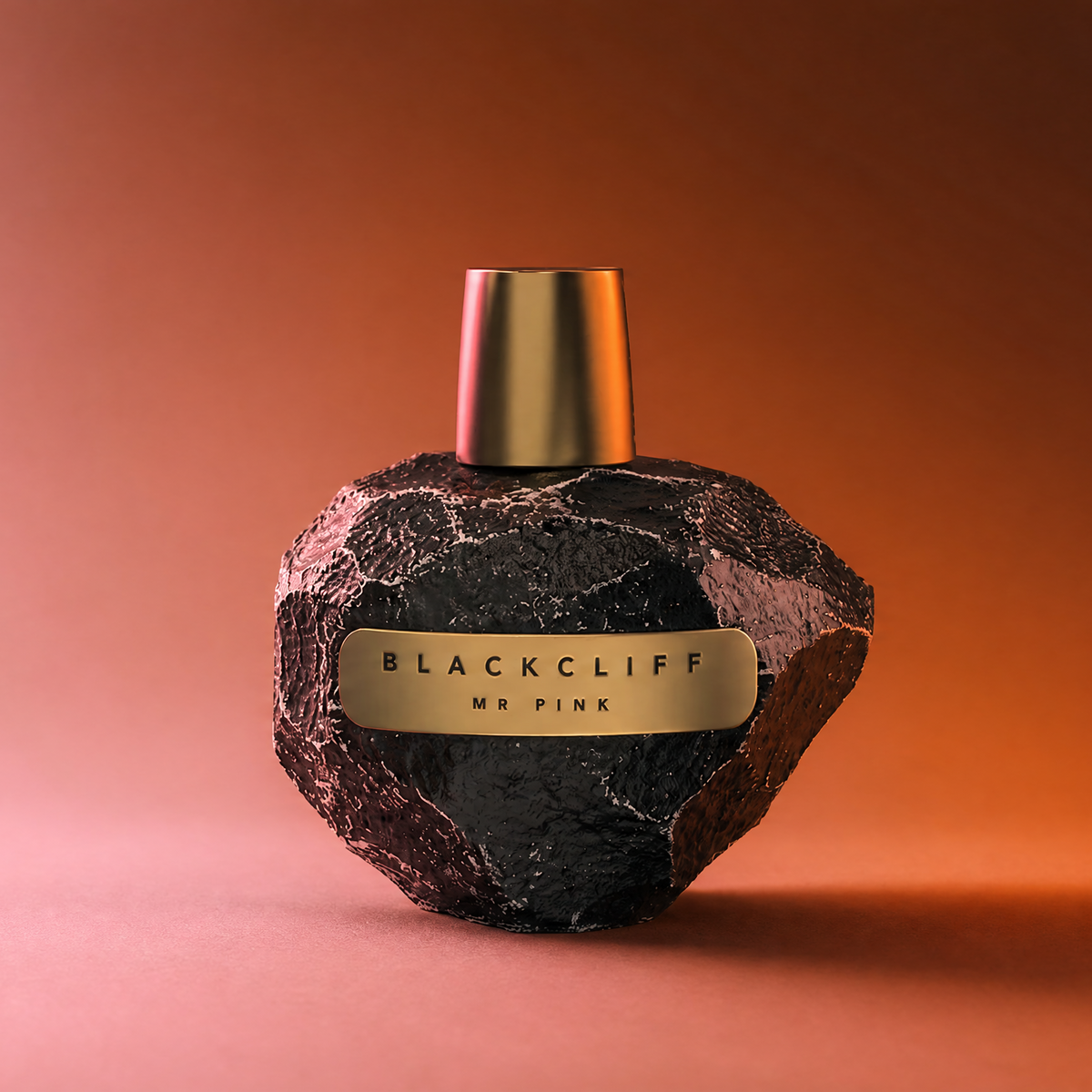 Black perfume bottle with gold cap and "BLACKCLIFF MR PINK" label