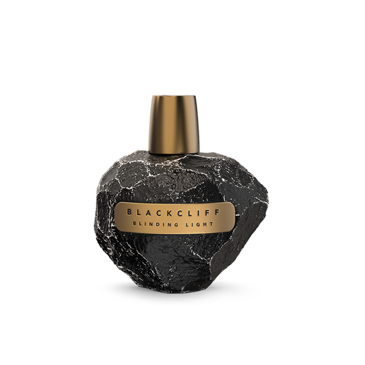 Perfume bottle: black stone-textured glass with gold cap and label