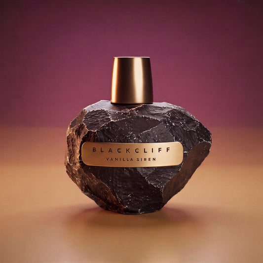Vanilla Siren perfume bottle, dark faceted stone body with gold cap and label
