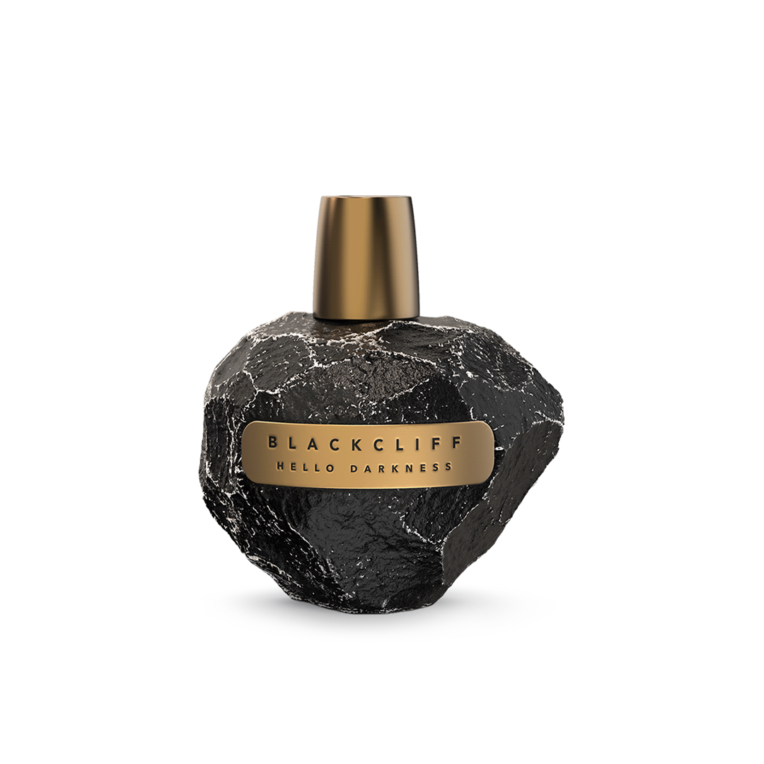 Black stone-look perfume bottle with gold cap and rectangular label