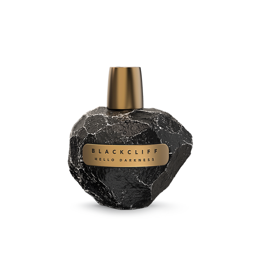 Black stone-look perfume bottle with gold cap and rectangular label