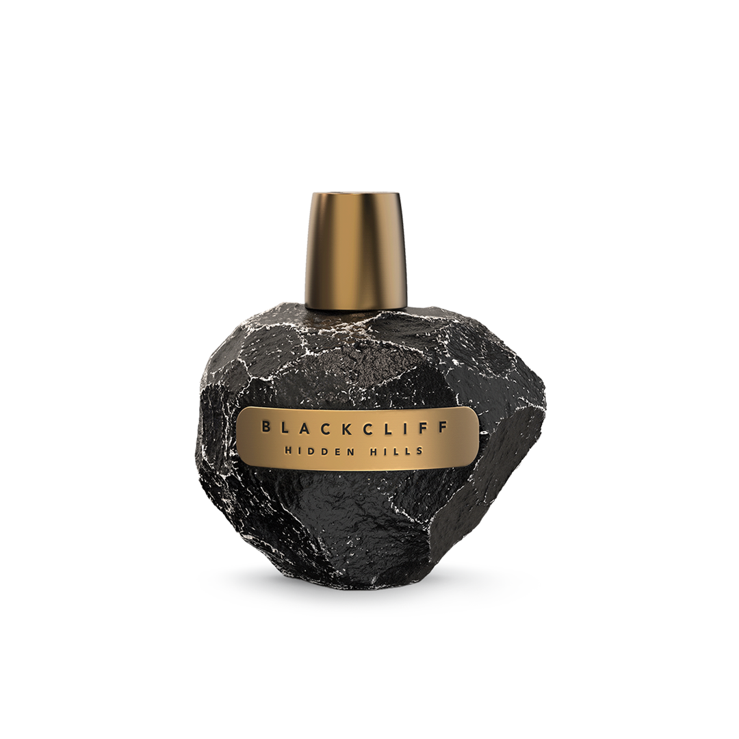 Hidden Hills Blackcliff fragrance bottle with gold cap and stone-textured black body