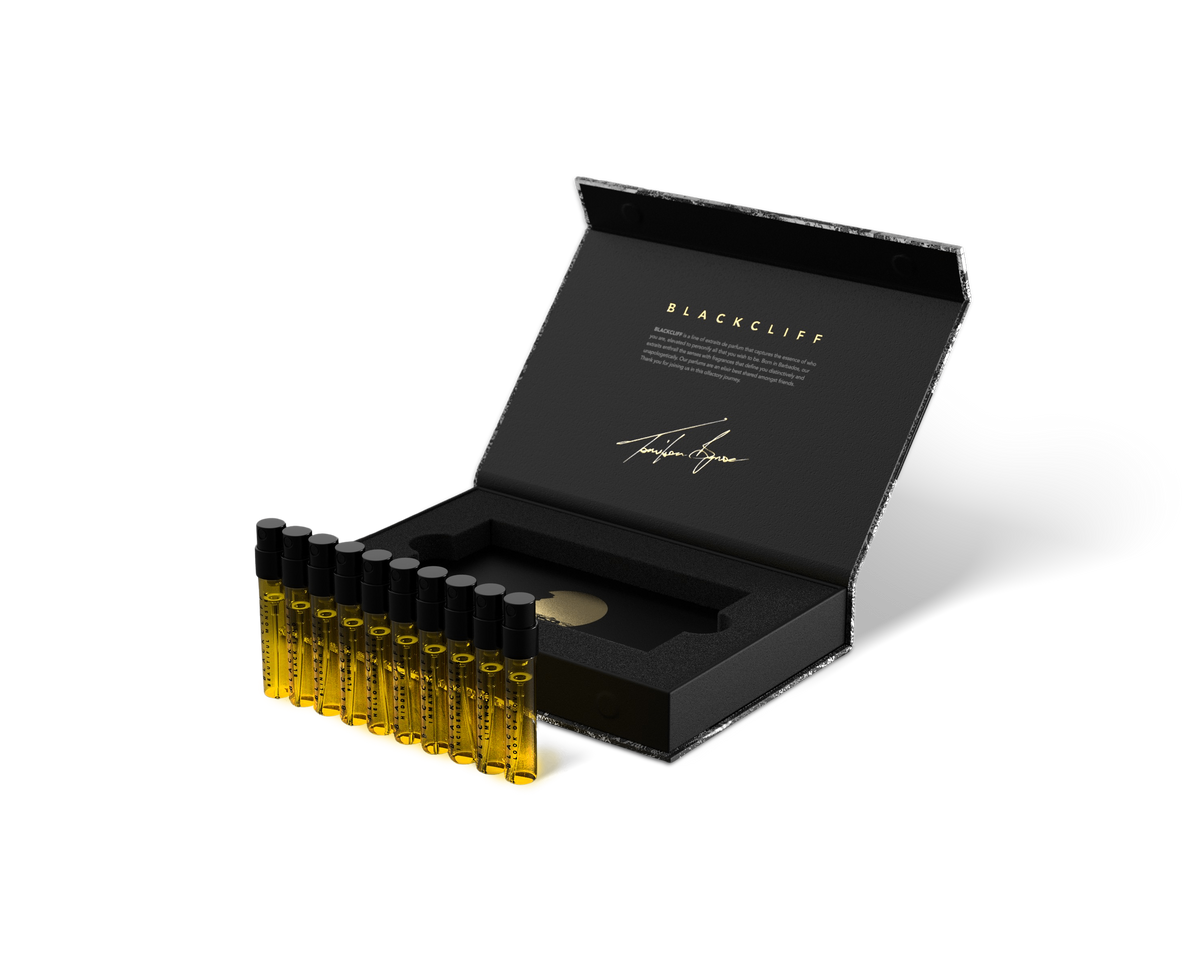 Open 10-pack set case with gold-toned mini bottles in black foam tray