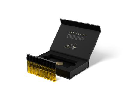 Open 10-pack set case with gold-toned mini bottles in black foam tray