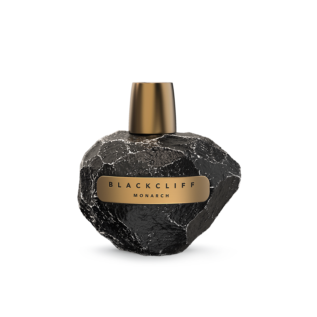 Spherical black perfume bottle with gold cap and gold label reading Blackcliff Monarch